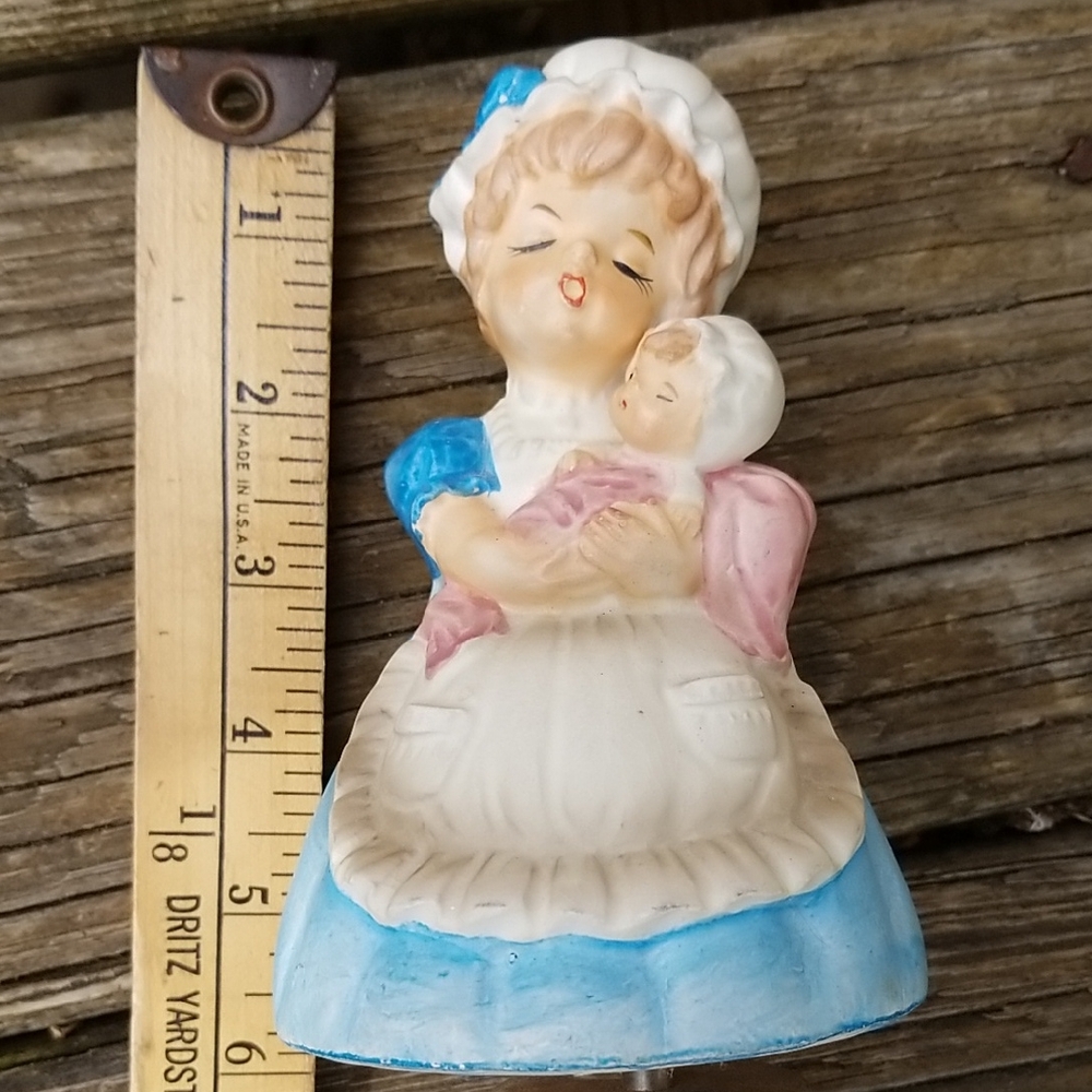 Antique musical figurine of mother with baby that plays Brahms Lullaby